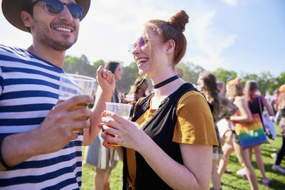 Friends dancing at music festival