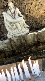 Statue of buddha against temple