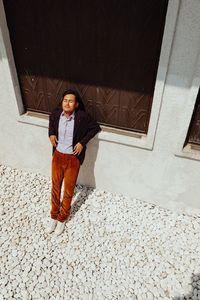 High angle view of man standing against window