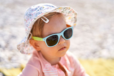 Portrait of young woman wearing sunglasses