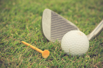 Close-up of golf ball on field