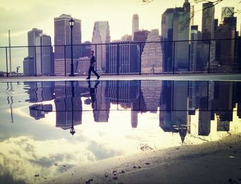 Skyscrapers against cloudy sky