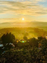 Scenic view of landscape against sky during sunset