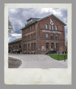 Building by road against sky