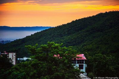 Scenic view of mountains against sky at sunset