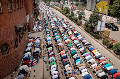 High angle view of people on street amidst buildings