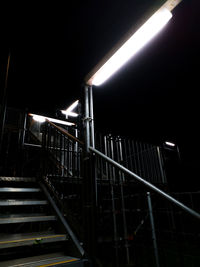 Low angle view of illuminated staircase at night