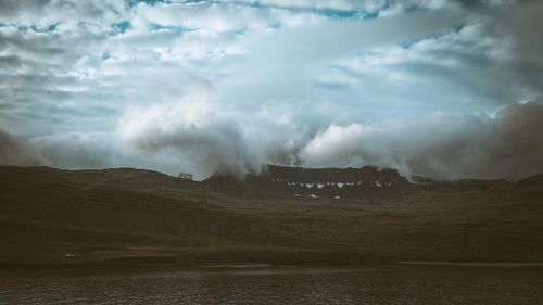 Scenic view of land against sky