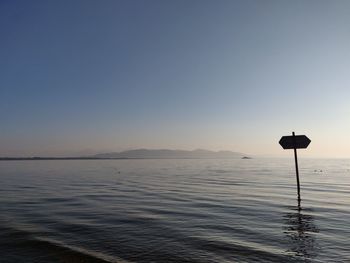 Scenic view of sea against clear sky during sunset