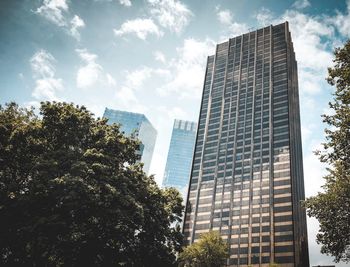 Low angle view of modern buildings against sky