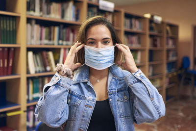 Portrait of a girl wearing a mask to enter the library