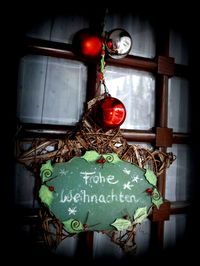 Close-up of christmas decoration hanging on wall