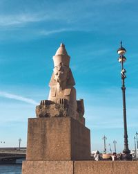 Statue of historic building against sky