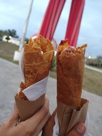 Close-up of hand holding ice cream cone