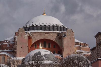 Hagia sophia against cloudy sky during winter