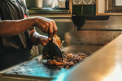 Man preparing food in kitchen