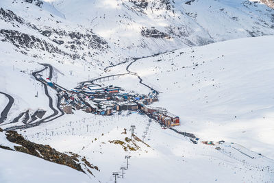 Roads going and out pas de la casa town in the valley between mountains, andorra