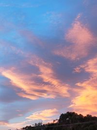 Low angle view of dramatic sky during sunset