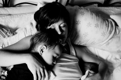 Portrait of cute boy sleeping on bed