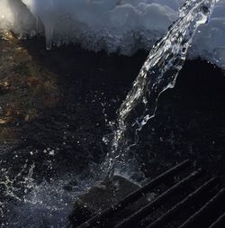 Close-up of water splashing at night