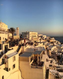 High angle view of cityscape against clear blue sky