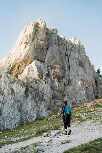 Low angle view of woman hiking in a rocky environment
