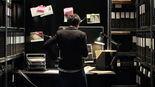 Rear view of woman standing in store