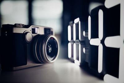 Close-up of camera on table