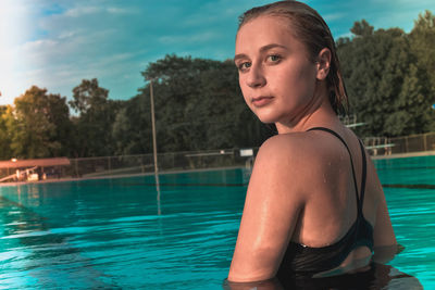 Portrait of young woman in swimming pool