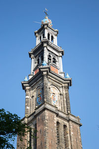 Low angle view of clock tower against sky