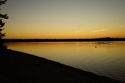 View of calm lake at sunset