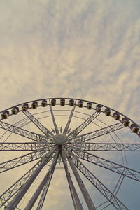 Low angle view of ferris wheel against sky