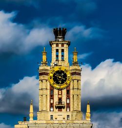 Low angle view of clock tower against sky