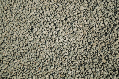 Detail of rough gravel background in a road near bento gonçalves. brazil.