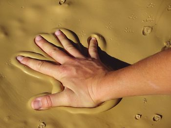 Close-up of man touching hand