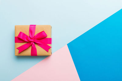 High angle view of gift on blue background