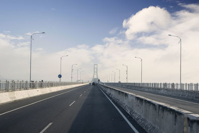 Empty road against sky