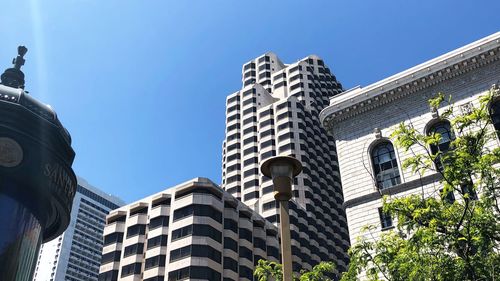 Low angle view of buildings against sky in city