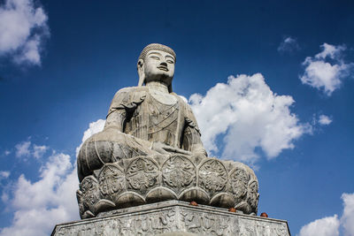 Low angle view of statue against sky