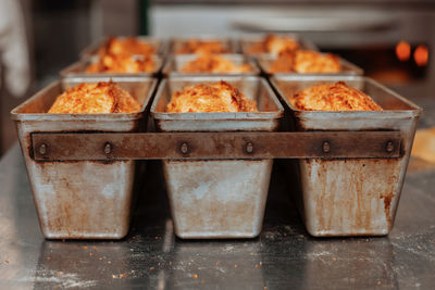 Freshly baked bread in molds on the table in bakery