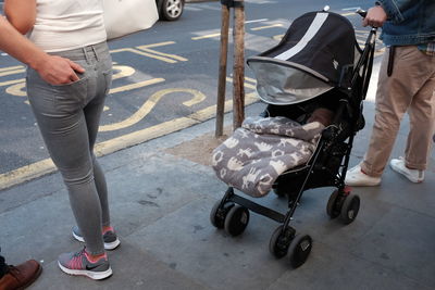 Low section of two people on road