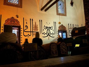 Men on table in illuminated room