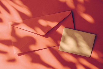 High angle view of gift box on yellow background