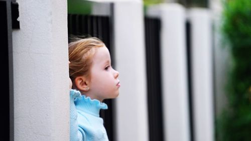 Cute girl looking away in city