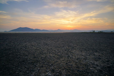 Scenic view of landscape against sky during sunset