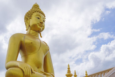 Low angle view of statue against sky