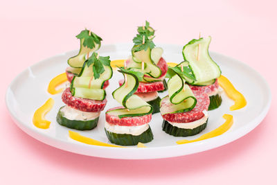 Close-up of food in plate on white background