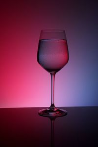 Close-up of red wine on white background