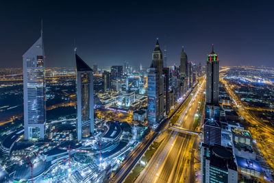 High angle view of illuminated buildings at night