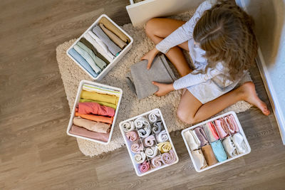 High angle view of woman sitting on table